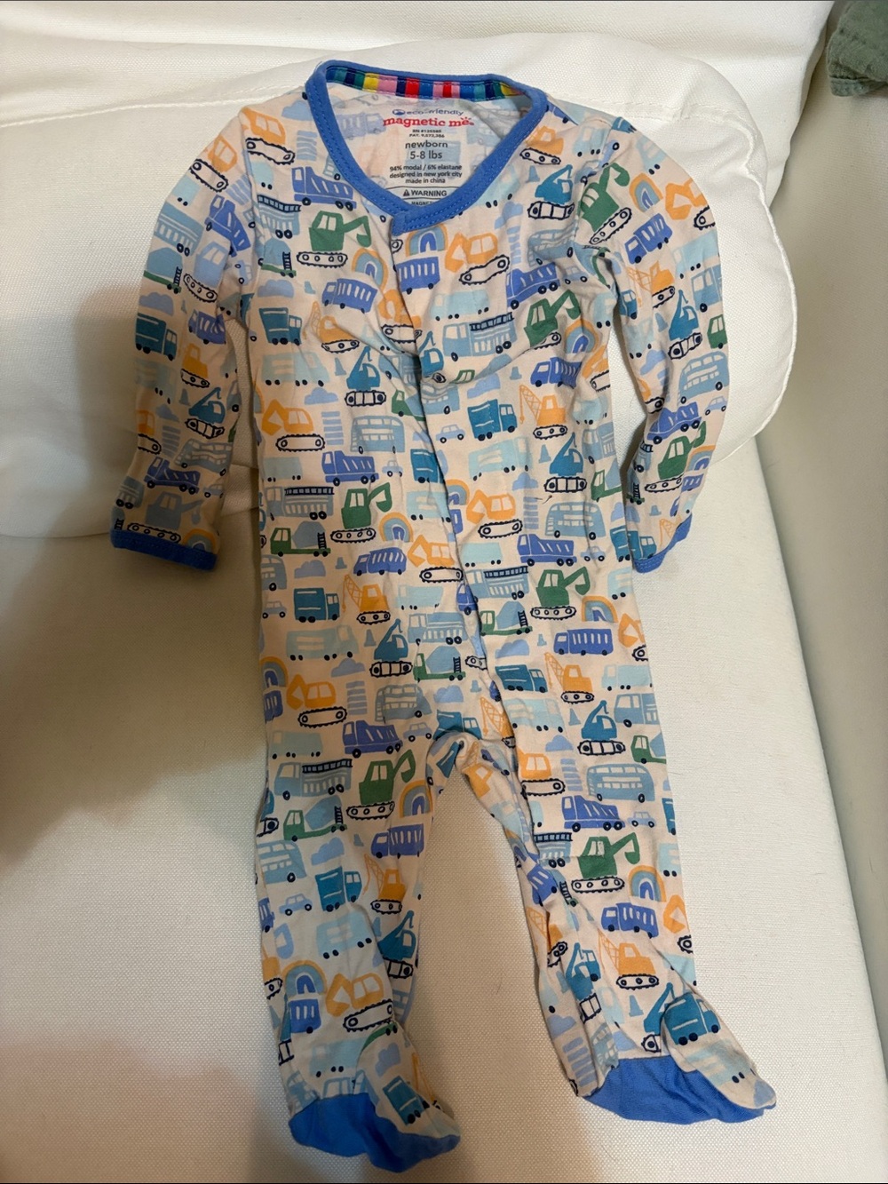 Magnetic Me White One-Piece with Blue, Green & Orange Vehicle Print